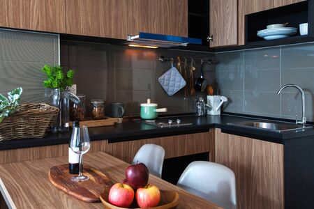 Corner kitchen with dining table in the room condominium.