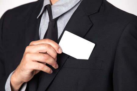 A Businessman takes a card out of his suit.の写真素材