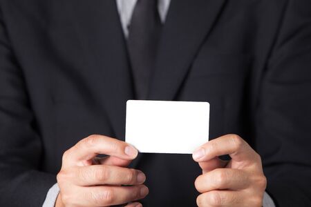 A Businessman showing his name card.の写真素材