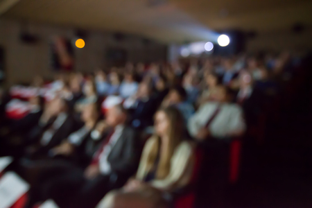 Blurry background of people watching movie in the movie theater.の写真素材