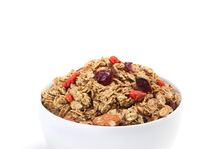 Close up Granola on white bowl isolated on white background.の写真素材