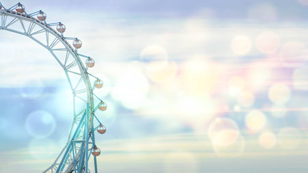 Ferris wheel over blue sky and sun without people at amusement park.の写真素材