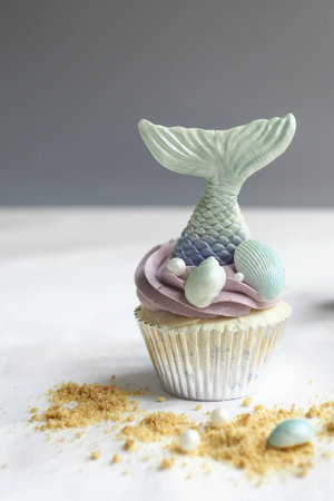 Mermaid cupcakes decorate with shell,fin and crumble.の写真素材