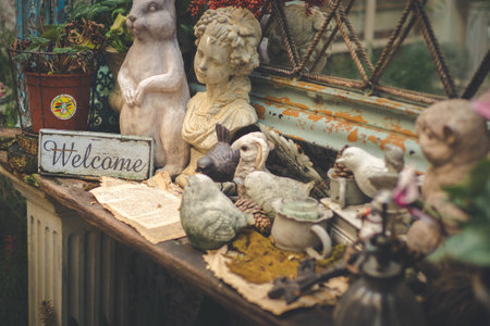 Vintage welcome signboard with animal and human statue.の写真素材