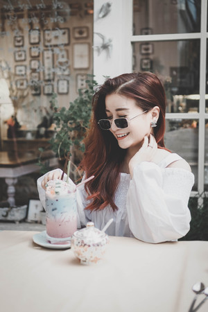 Women drinking pastel (pink and blue) beverage (milk shake), Women lifestyle,holiday.