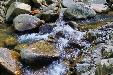 The water that flows through the rocksの写真素材