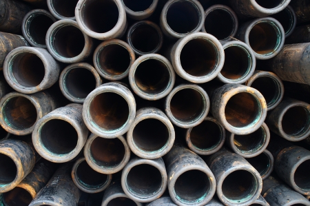 Stack of oilfield casing on the drilling rigの写真素材