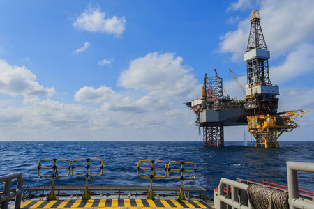 Offshore Jack Up Drilling Rig Over The Production Platform in The Middle of The Sea