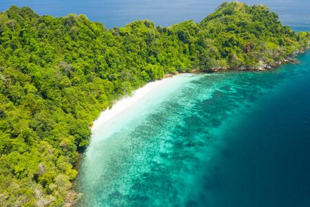 Aerial view from a drone of beautiful Nyaung Oo Phee island on sunny day in Myanmar