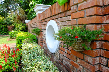 Garden and brick wall backgroundの写真素材