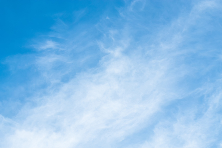 Blue background with some clouds. A refreshing dayの写真素材