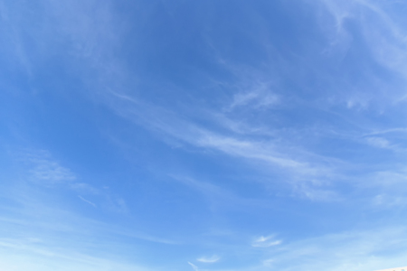 Clouds and the sky in the winter with clear clouds floating into a happy day.の写真素材