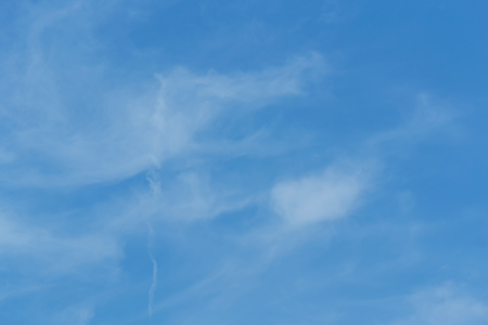 The sky with the clouds moving in the wind is a small group of clouds.の写真素材