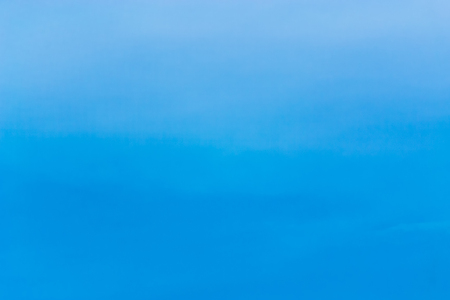 clear blue sky with plain white cloud with space for textの写真素材