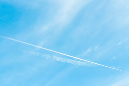 clear blue sky with plain white cloud with space for textの写真素材