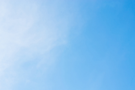 Blue background with some clouds. A refreshing dayの写真素材
