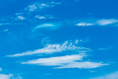 The blue sky with the backdrop of contrasting clouds is an inviting image.の写真素材