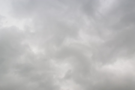 Before the rain fell, the clouds gathered together in the darkness of the sky.