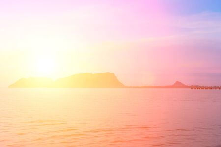 Bright colors at dawn on the beach at sunrise in the Gulf of Thailand.