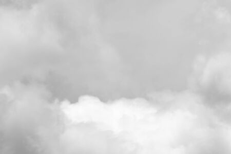 Before the rain fell, the clouds gathered together in the darkness of the sky.の写真素材