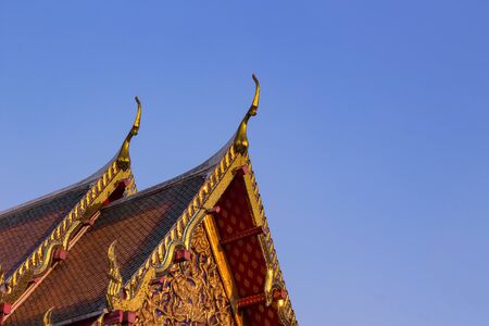 The temple rooftop on blue sky backgroundの写真素材