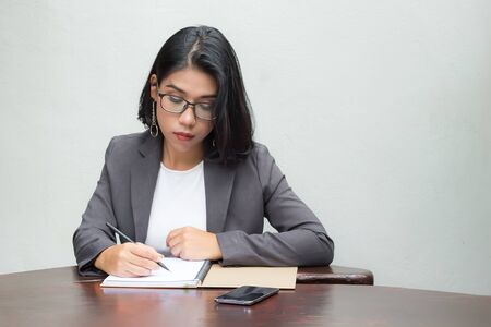 Portrait of a bussiness woman working on the desk