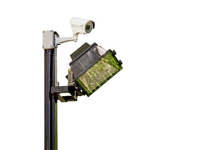 Traffic intersection signal surveillance camera with lights on white background