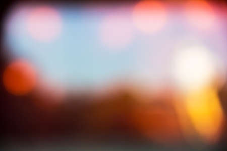 Red and orange holiday bokeh. Abstract Christmas backgroundの写真素材