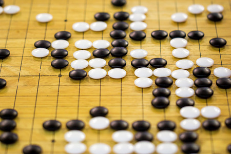 closeup of stones on a Go boardの写真素材