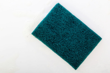 scrubber pad with sponge and bubble of washing liquid