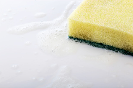 scrubber pad with sponge and bubble of washing liquid