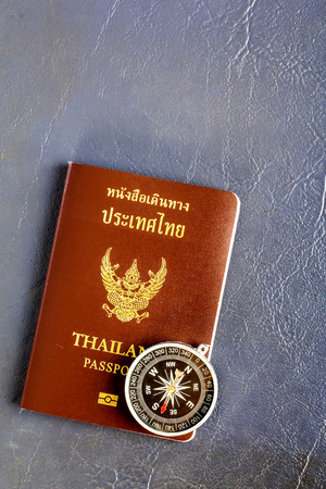 compass and passport thailand on Leather Cover backgroundの写真素材