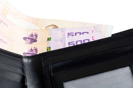 Black leather wallet with money isolated on white background