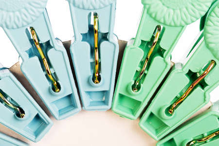 Plastic Clothes Pegs on White Backgroundの写真素材