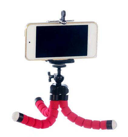 Small tripod made of aluminum. Tripod for small cameras and telephones on white backgroundの写真素材