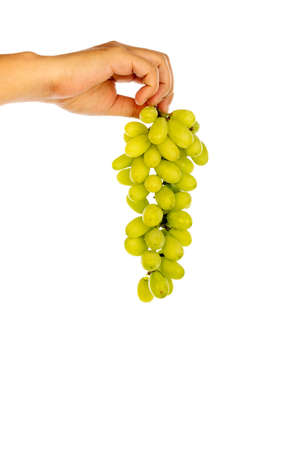 hand holding a bunch of green grapes Isolated on white backgroundの写真素材