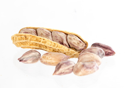 Peanuts in close up on a white background