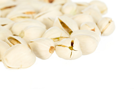 Pistachio nuts isolated on a white background
