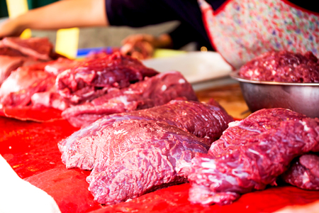 fresh raw meat fillets at the marketの写真素材