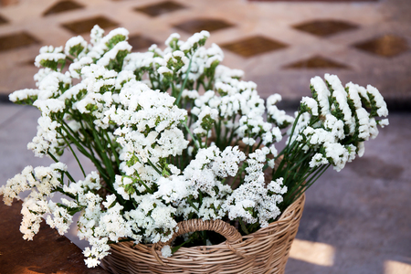White gypsophila bouquet in basketの写真素材