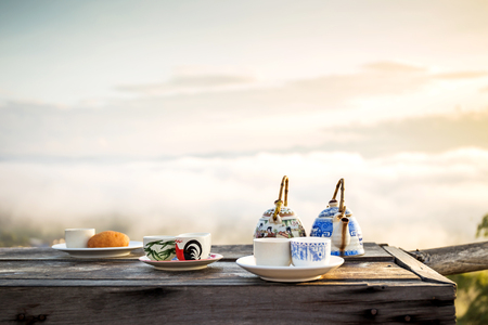 Sipping tea Sea fog Yun Lai Cup of tea and a glass of water.の写真素材