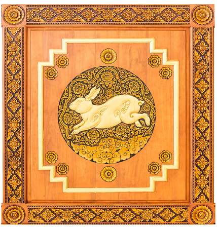 Traditional Thai style wood carving rabbit of 12 Zodiac,on the wall of temple in Thailandの写真素材
