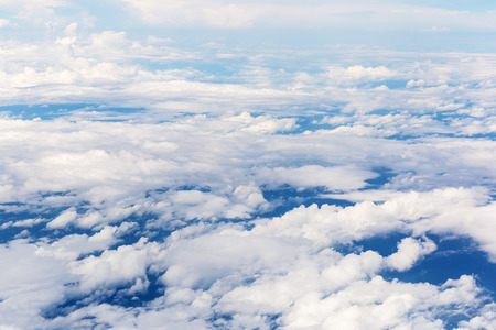 clouds and blue sky seen from planeの写真素材