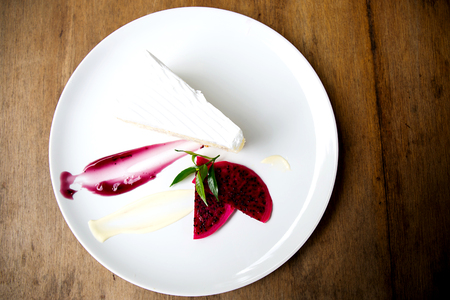 Coconut cake on white plate on tableの写真素材