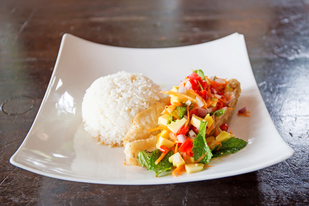 Soft rice and grilled fish Dolly bento with vegetables, selective focus.の写真素材