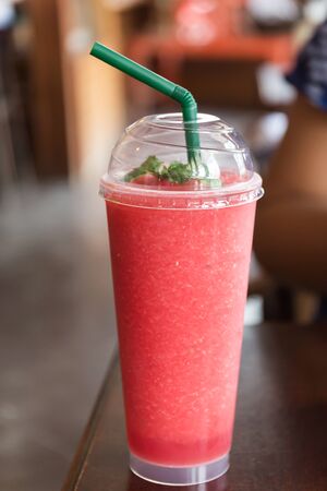 Watermelon juice in plastic cupの写真素材
