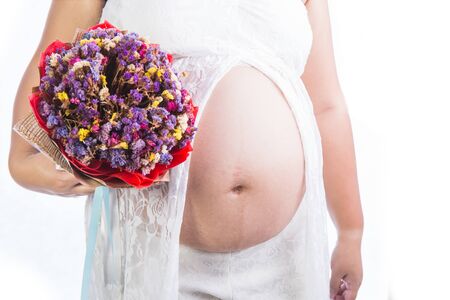 Pregnant woman and Flower isolated on white backgroundの写真素材