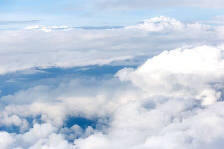 clouds and blue sky seen from planeの写真素材