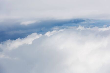 clouds and blue sky seen from planeの写真素材