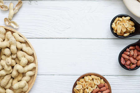 Top view of peanut butter placed on white wooden background.の写真素材